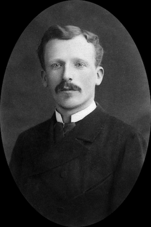 black and white picture of Theo van Gogh, Vincent's brother. He has short hair, a mustache, and is wearing a dark suit.